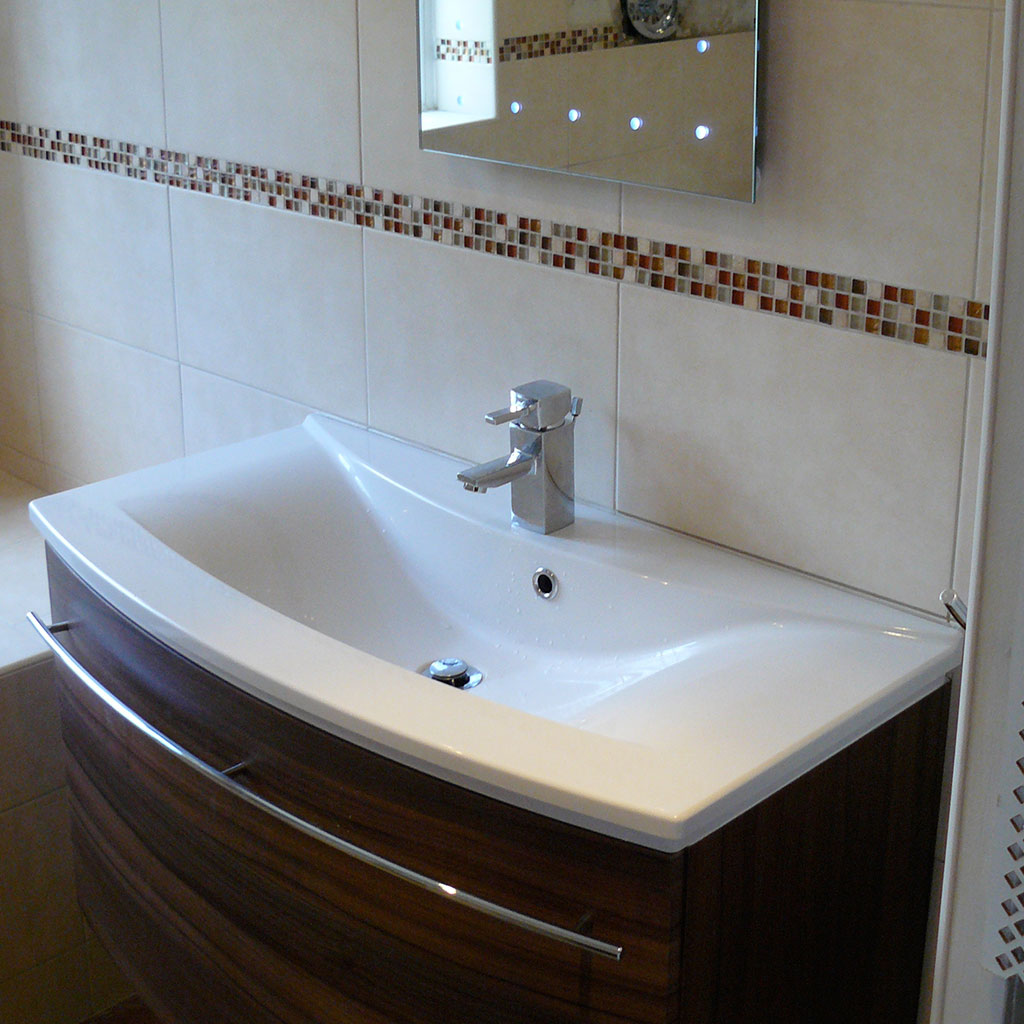 Curved sink and tiling.